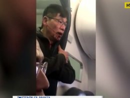 Скандал в самолете: пассажира американской компании United Airlines силой сняли с рейса и избили!